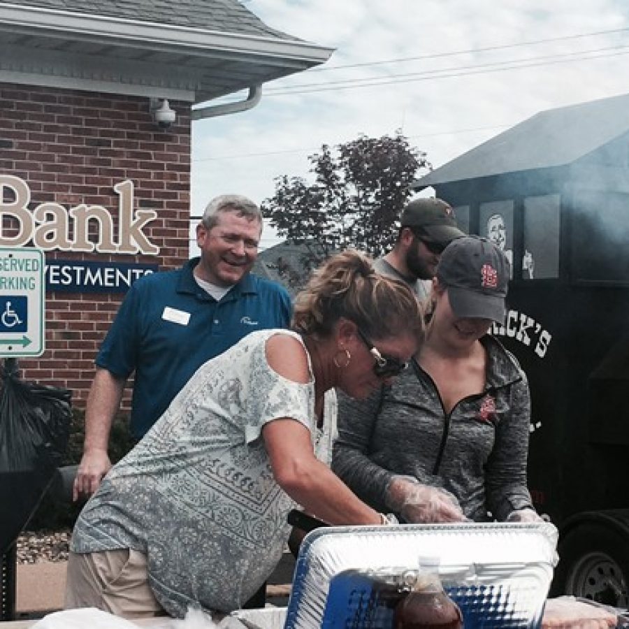 Hundreds of Oakville residents lined up for free barbecue at the Fortune Bank grand opening Aug. 27, above.