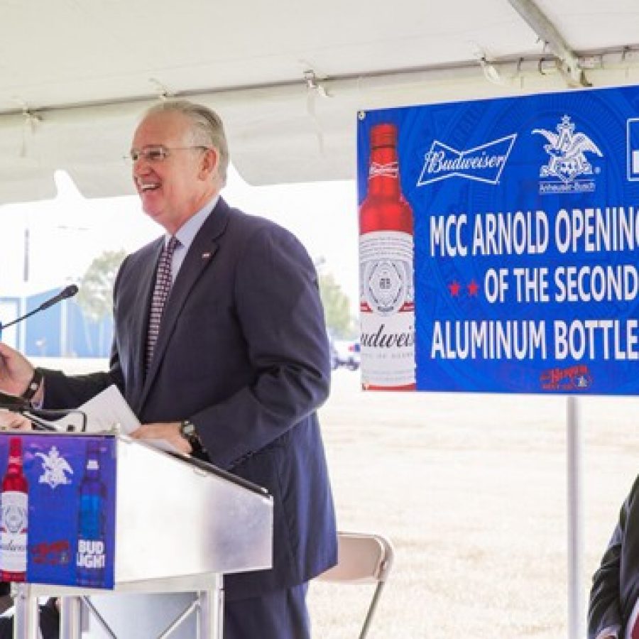 Bud Light in hand, Gov. Jay Nixon celebrates the recent opening of a new \$160 million Anheuser-Busch aluminum-bottle line at the Metal Container Corp. plant in Arnold.