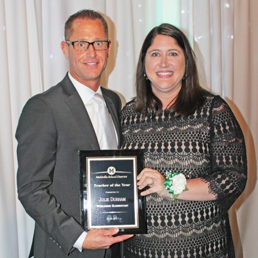 Mehlville School District Teacher of the Year Julie Durham is pictured with Assistant Superintendent Jeff Bresler at the districts annual Recognition Night.