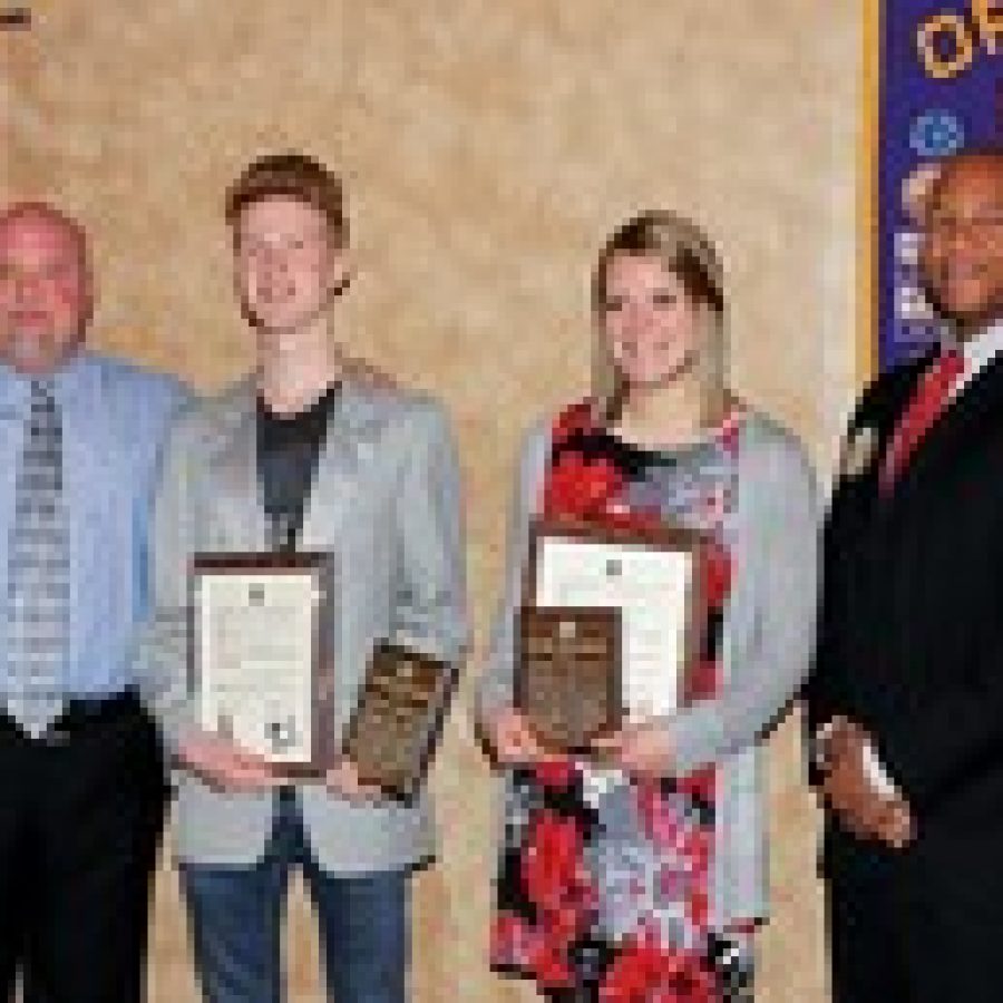 Students of the Month Brian Barrett and Anne Massey are pictured with Ryan Sherp, left, Lindbergh High School 12th-grade principal, and John Roland, Optimist Club Student of the Month chairman. 