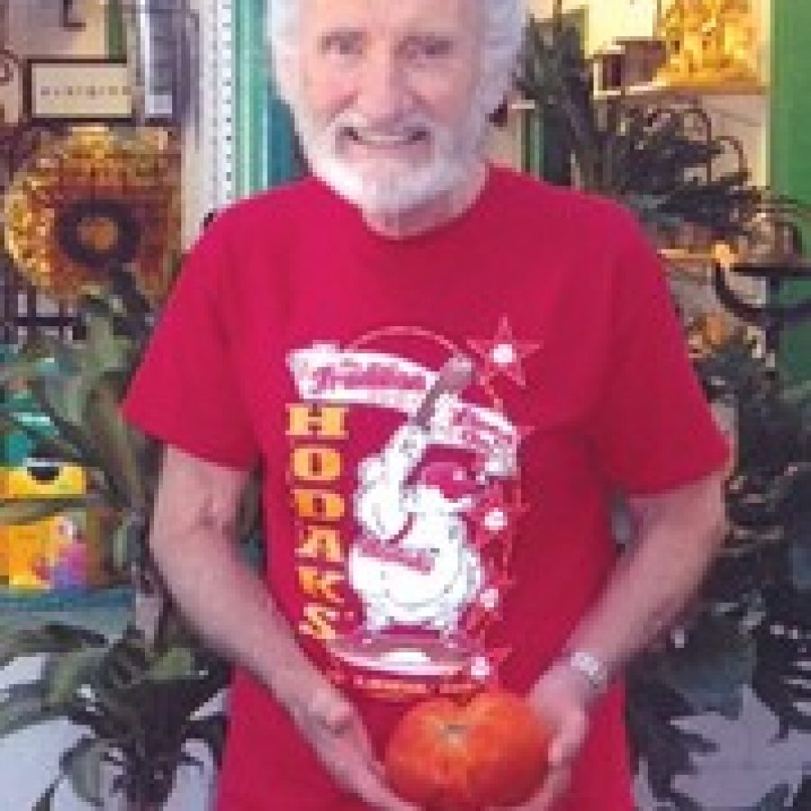 Tony Flieg with his 1.5-pound tomato. 