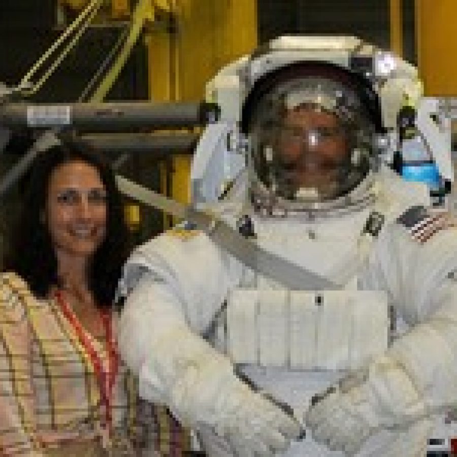 Sappington Elementary School physical education teacher Mary Driemeyer meets astronaut Reid Wiseman during the Train Like an Astronaut program at Johnson Space Center. 