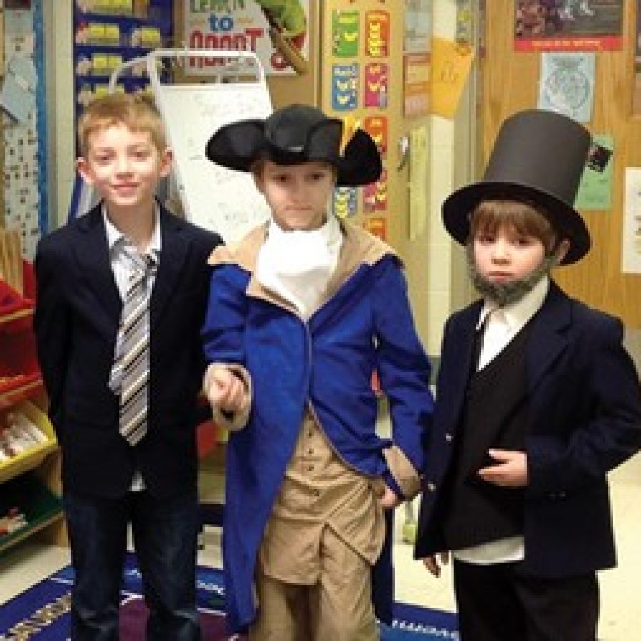 Kennerly second-graders Spencer Cruzen, Robert Chavez and Jake Lape portrayed John F. Kennedy, George Washington and Abe Lincoln for the schools annual Biography Parade.
 