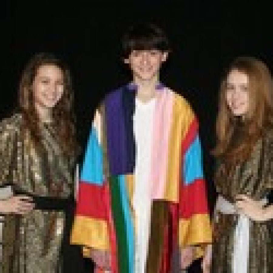 Joseph in St. Margaret Marys production of Joseph and the Amazing Technicolor Dreamcoat is played by seventh-grader Alex Curcuru, while narrators are eighth-grader Jeanna Picha, left, and eighth-grader Abby Dawson. 