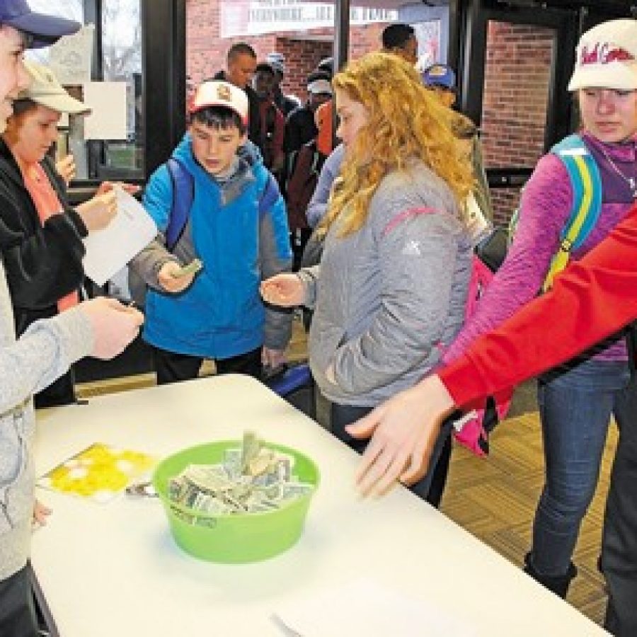 Oakville students conduct fundraiser for local cashier