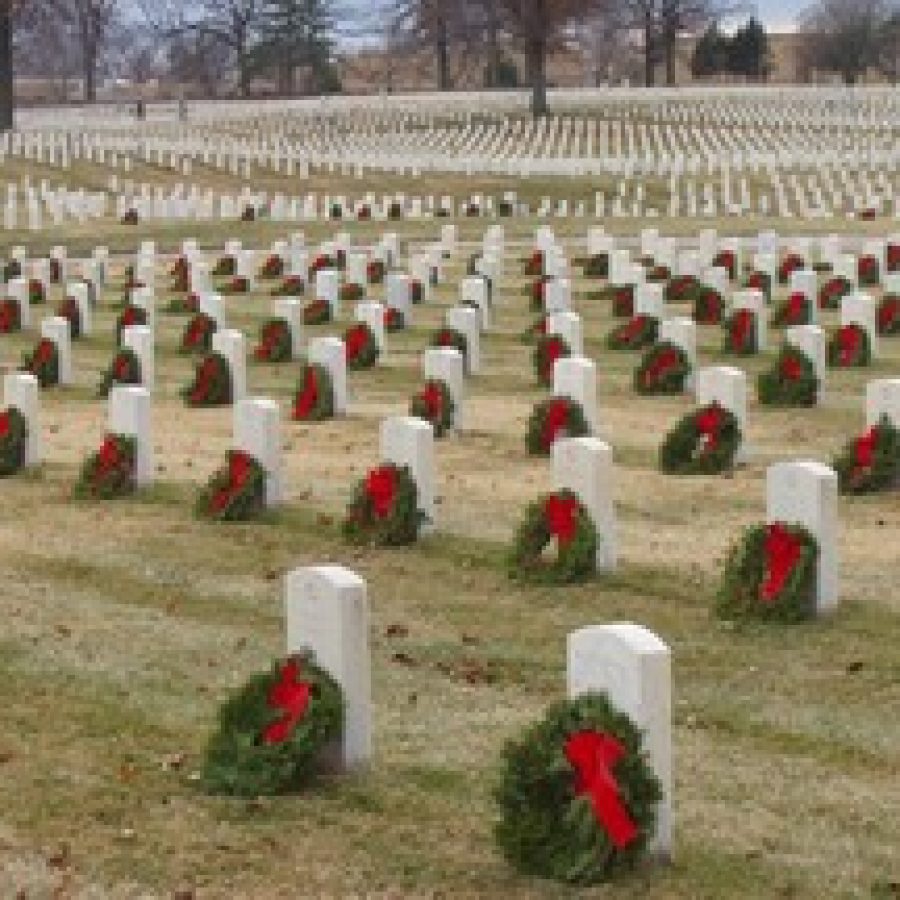 Remembrance wreaths adorn veterans gravesites at Jefferson Barracks National Cemetery.