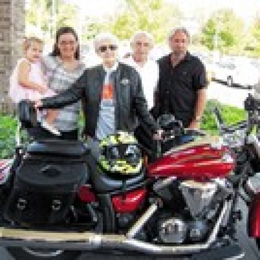 Concord resident Edie Simms, center, is pictured with four generations of her nieces and nephews on her 100th birthday, just before she took her first-ever ride on a motorcycle at Orchid Terrace. Photo by Gloria Lloyd 