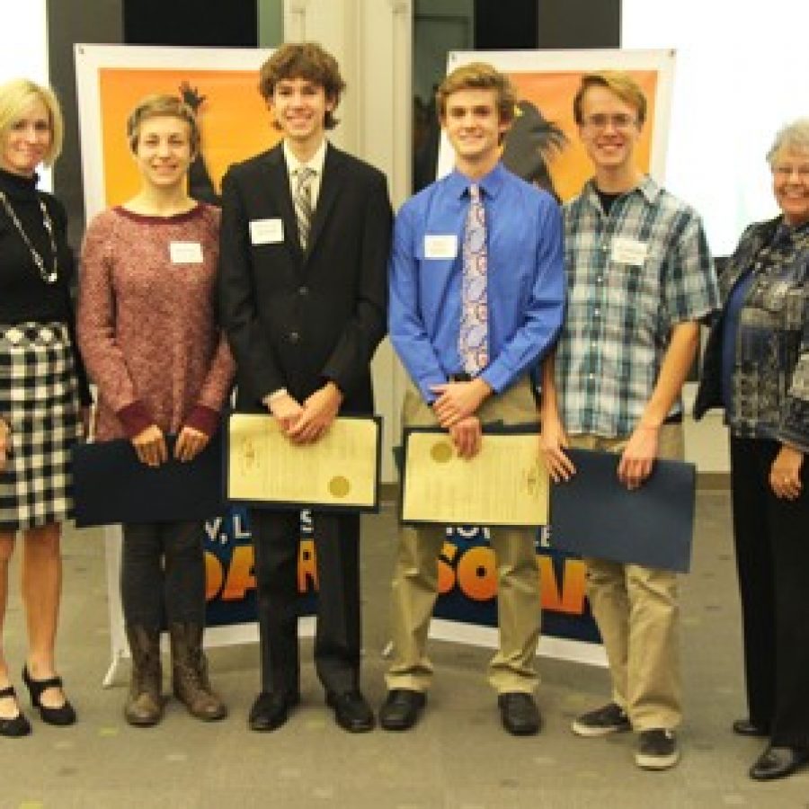 Reps. Genise Montecillo, left, and Cloria Brown, right, congratulate Lindbergh High Schools four 2016 National Merit Semifinalists during a reception Tuesday night. This years semifinalists include, from left, Natalie Schodl, Alexander Schaff, Kyle Gibbs and Jonathan Black.