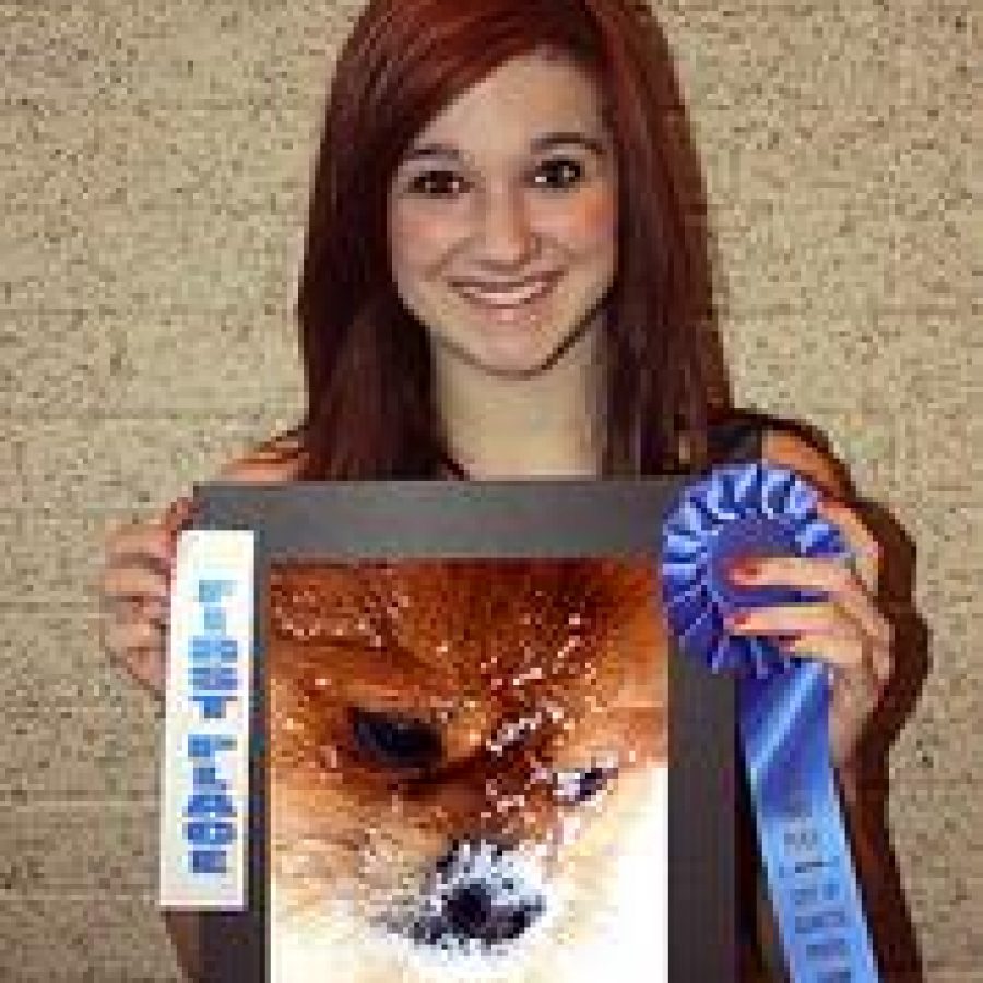 OHS freshman Katie Bentlage earned first place and a \$50 U.S. Savings Bond in the Color Photo category at the Olivette Photography Show for her photo of her dog, Max. 