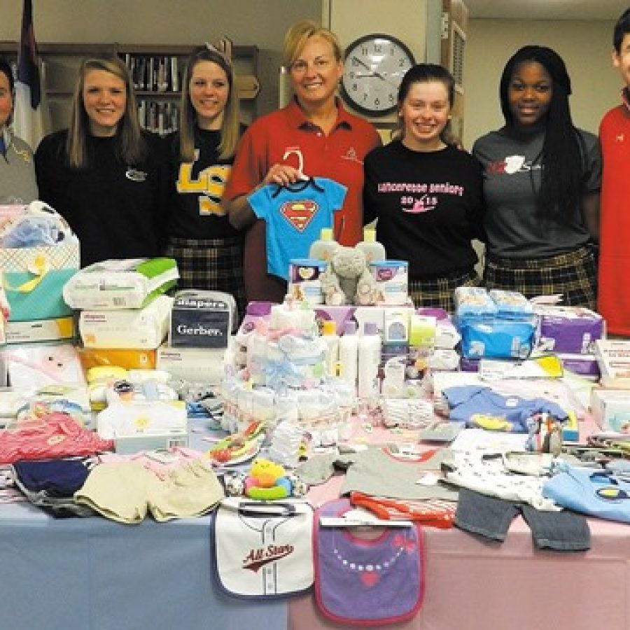 Pictured, from left, are: Lutheran South Key Club members Tim Wilkinson, Catherine Hopkins, Jennifer Daniels, Janet Leigh of Nurses for Newborns, Megan Weltmer, Cecilya Johnson and Hayden Rosenthal.