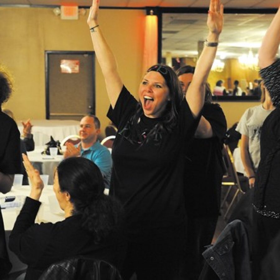 Mehlville School District residents celebrate the historic passage of Proposition R at a victory party at Andres South last week. Reacting to the news that Prop R passed with nearly 73 percent of the vote, from left, are: Bernard Middle School eighth-grader Samantha Gindler, Oakville Elementary School parent Jane Kolb and Kimberly Hanan-West, who led the Mehlville-Oakville United Committee that promoted passage of the measure.