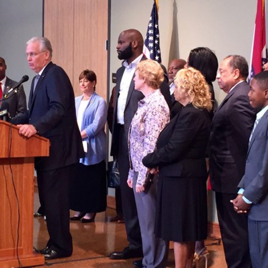 Gov. Jay Nixon, second from left, stands with a sea of state legislators behind him as he announces his veto of the transfer bill at Ritenour High School last week. Among the legislators pictured include, starting with third from right, Rep. Jill Schupp, D-Creve Coeur, Rep. Clem Smith, D-Normandy, and Rep. Tommie Pierson, D-Bellefontaine Neighbors. Second from right is Piersons intern, frequent County Council speaker Marquis Govan, 12.