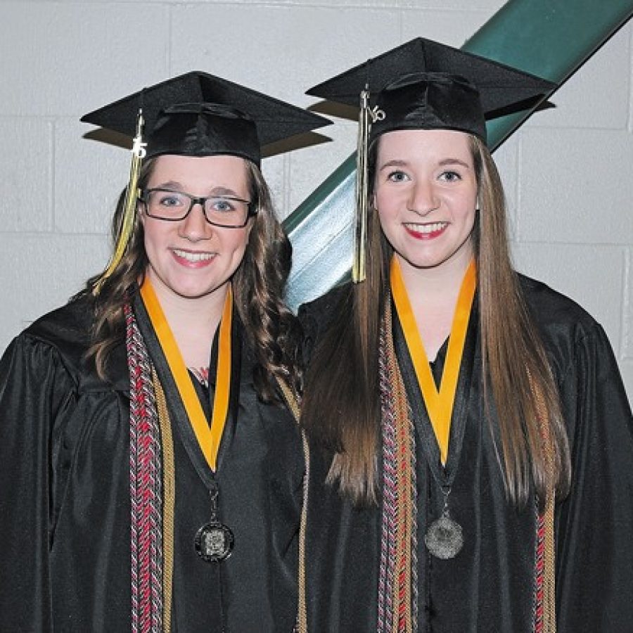Oakville twins graduate at top of their class