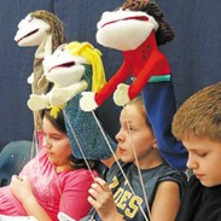 Fifth-grade students in Mehlville School Districts gifted program, Supplementary Teaching Resources for Educationally Talented Children, or STRETCH, worked for weeks on a play demonstrating the benefits of service. STRETCH students, pictured, from left, are: Samantha Galayda, Josie Fisher and Alex Mittendorf. 