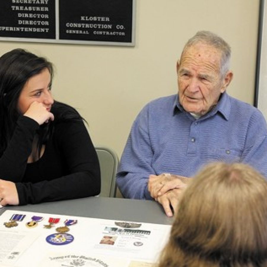 Lindbergh High School senior Jordyn Douglas listens with pride as her great-grandfather William McGrath shares stories about his experiences in the U.S. Air Force.