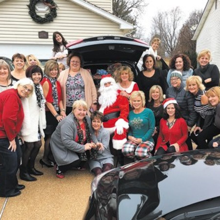 Members of Mehlvilles Caring Community Project attending their annual breakfast Saturday, from left, are: Marge Mesplay, Kata Lozina, Christy Franklin, Barb Tate, Tina Summers, Shirley Haegele, Geri Peters, Gina Ravens, on car, Debbie Shelby, Heather Flaherty, Patti Kappel, Sharon Beye, Santa, Terry Beye, Cindy Compton, Rhonda Houska, Linda Berkbigler, Cheryl Thomas, Lisa Mohr, Jeanne Kadane, Martha Perry, Ellen Keen and Tookie Carlson.