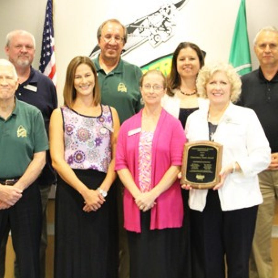 Lindbergh Schools Superintendent Jim Simpson, right, presents the Missouri School Boards Association 2016 Governance Team Award to the Board of Education. Members, back row, from left, are: Mike Tsichlis, Gary Ujka and Treasurer Vicki Englund, Front row, from left, are: Vice President Don Bee, member Jennifer Miller, Secretary Karen Schuster and President Kathy Kienstra.
