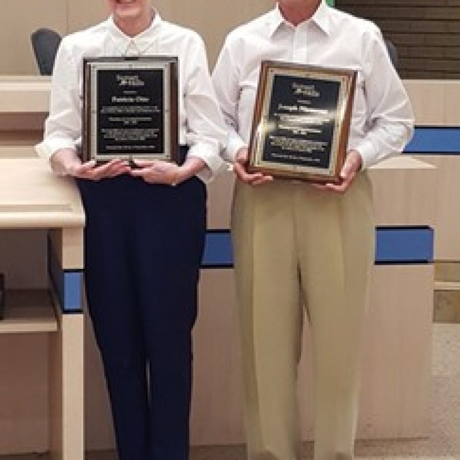 Longtime P&Z members Pat Otto and Joseph Niemeyer accept their plaques for their decades of service Sept. 7.