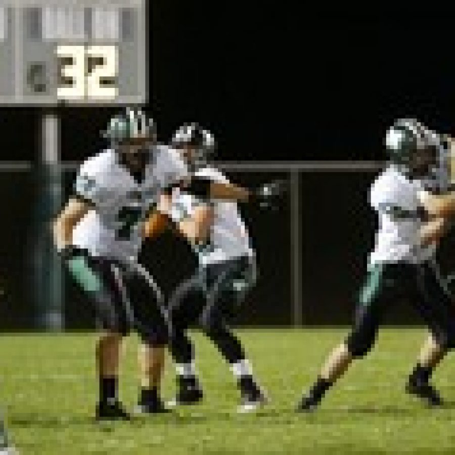 Lindbergh running back Steven Washington looks for room in the flat while Mehlvilles Nick Williams tries to contain him during the second quarter of play last Friday night. Washington netted a short gain, but the Panthers scored an upset by beating the Flyers 14-2. 