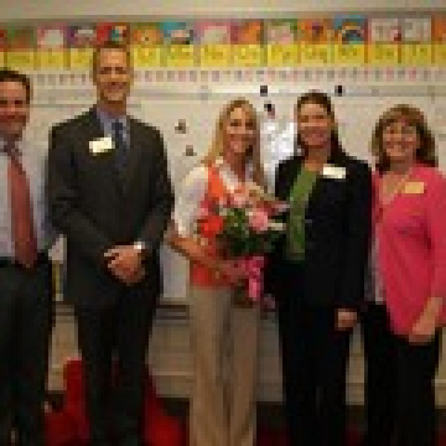 Trautwein Elementary first-grade teacher Christina Peterman was named the Mehlville School Districts 2011-2012 Teacher of the Year. Peterman will advance to the Missouri Teacher of the Year program. Pictured, from left, are: Trautwein Assistant Principal Patrick Keenoy, Superintendent Eric Knost, Peterman, Assistant Superintendent for Supervision of Schools Lisa Counts and Trautwein Principal Donna Wagener. 