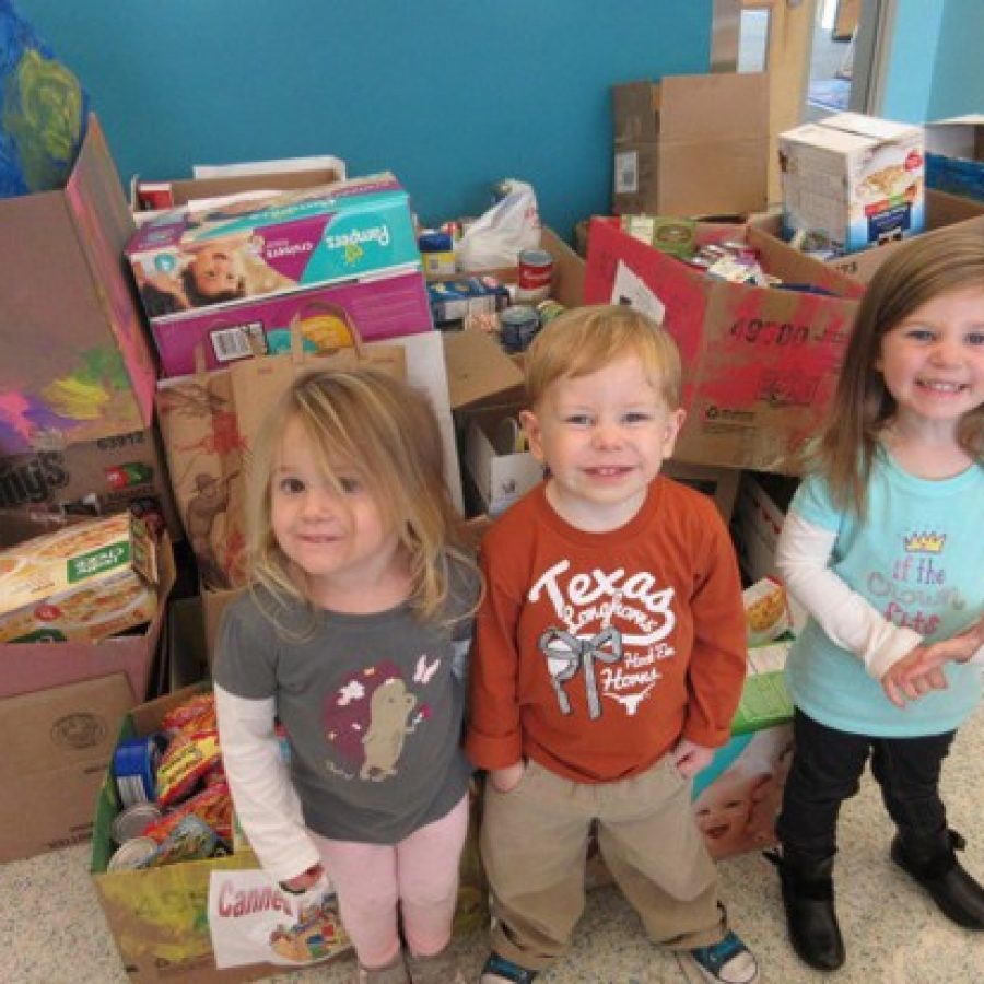 ECE students pose with the canned goods they collected, above.