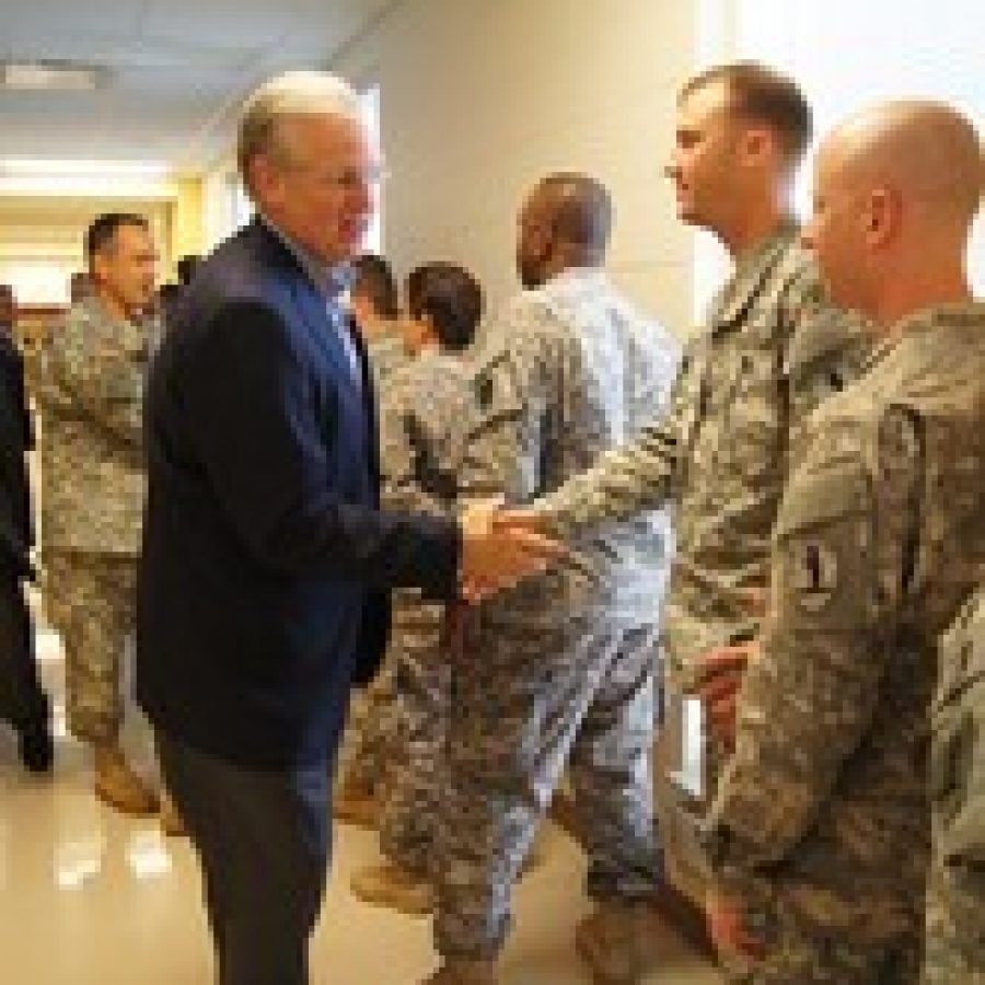 Gov. Jay Nixon welcomes home soldiers of the Missouri National Guards 3175th Chemical Company before a welcom- home ceremony for the unit Saturday at Jefferson Barracks. Behind Nixon is Maj. Gen. Stephen L. Danner, adjutant general of the Missouri National Guard.  