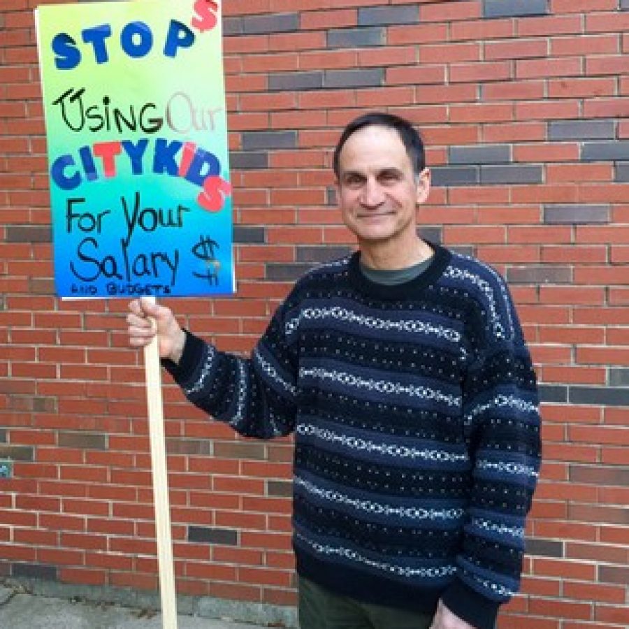 In this Call file photo, St. Louis Public Schools resident, above, protests Mehlvilles participation in the VICC voluntary transfer program outside the March 11, 2015 Mehlville Board of Education meeting, where the board first found out what budget cuts interim Superintendent Norm Ridder was suggesting.