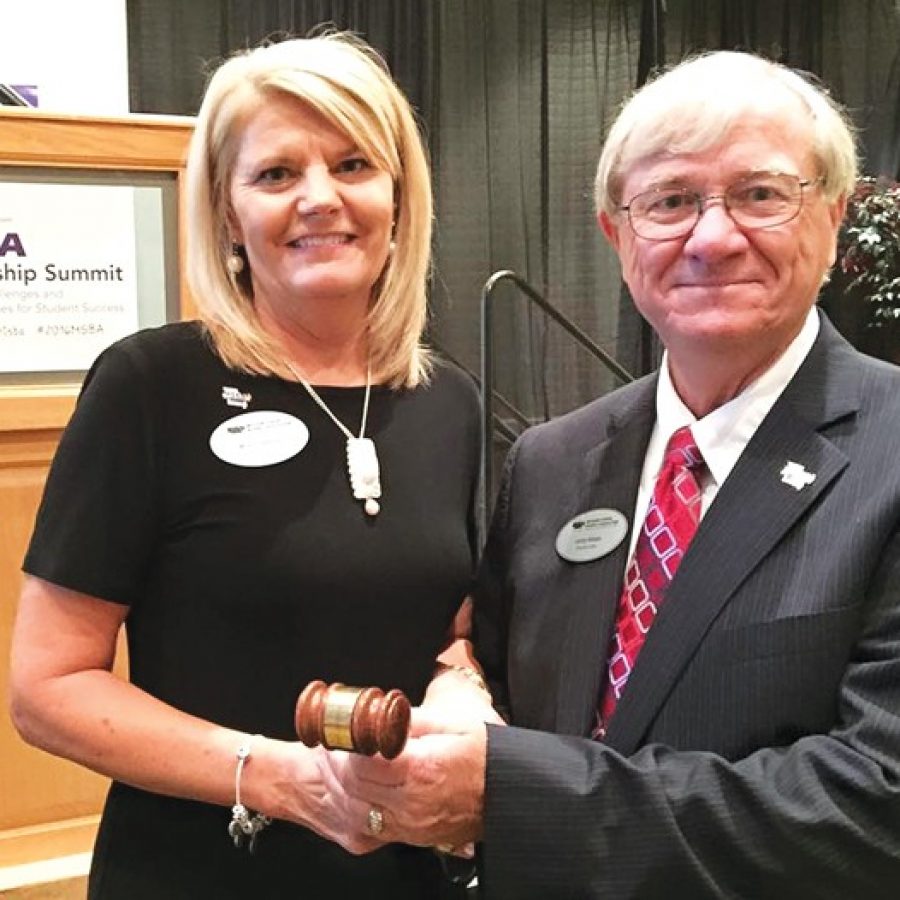 New Missouri School Boards Association President Larry Felton, a member of the Mehlville Board of Education, accepts the gavel from past President Mona Coleman of Bolivar during the MSBA Leadership Summit at Tan-Tar-A in Lake of the Ozarks.