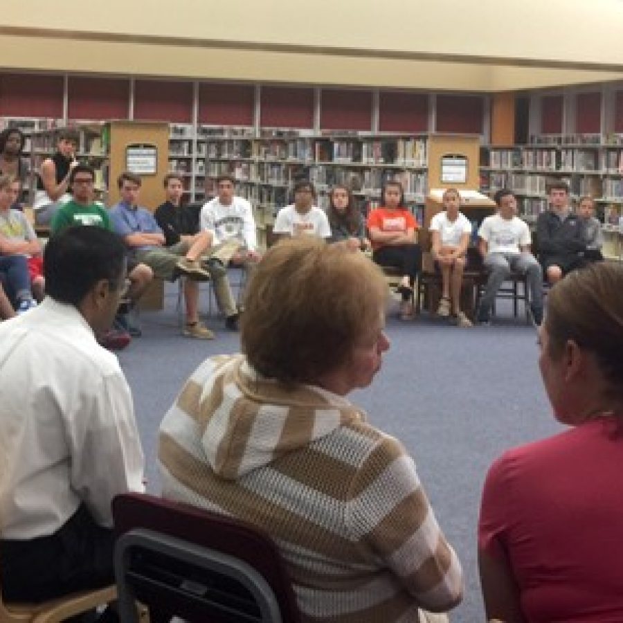 Mehlville board members, forefront, talk to the Mehlville Student Council last year about block scheduling and Prop R.