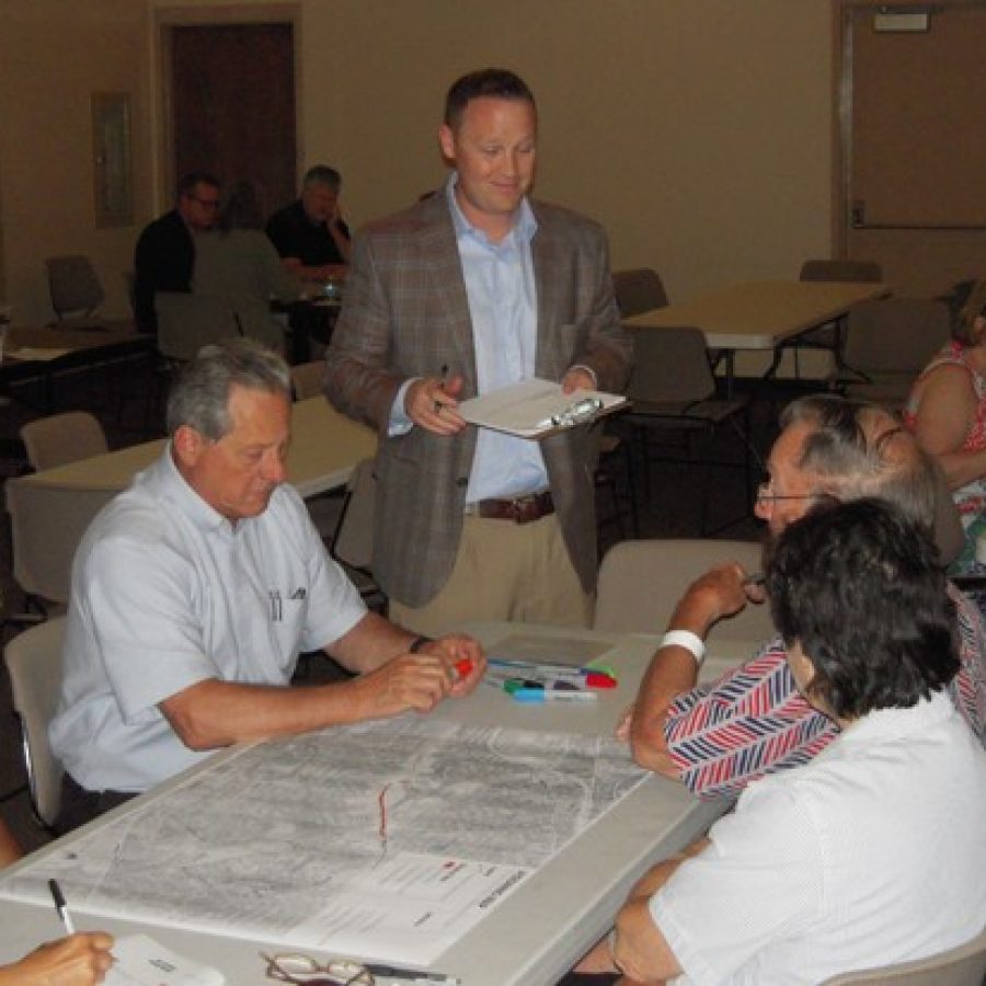 Crestwood City Planner Adam Jones, center, talks with Mayor Gregg Roby, left, and resident Robert Miller, right, at last weeks visioning workshop.