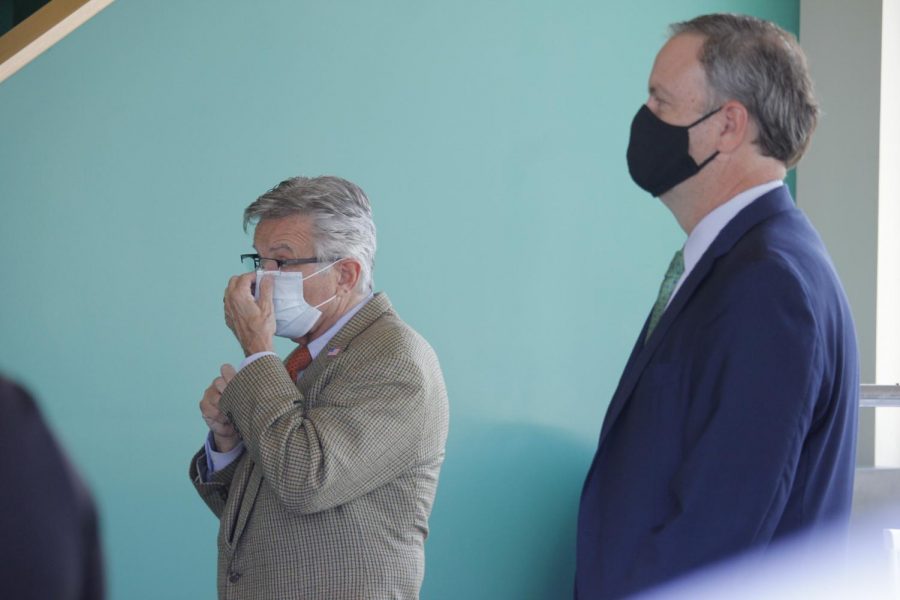 Both County Executive Sam Page and 6th District County Councilman Ernie Trakas don masks at the official ribbon-cutting at 9 Mile Garden in Affton July 9, 2020. 