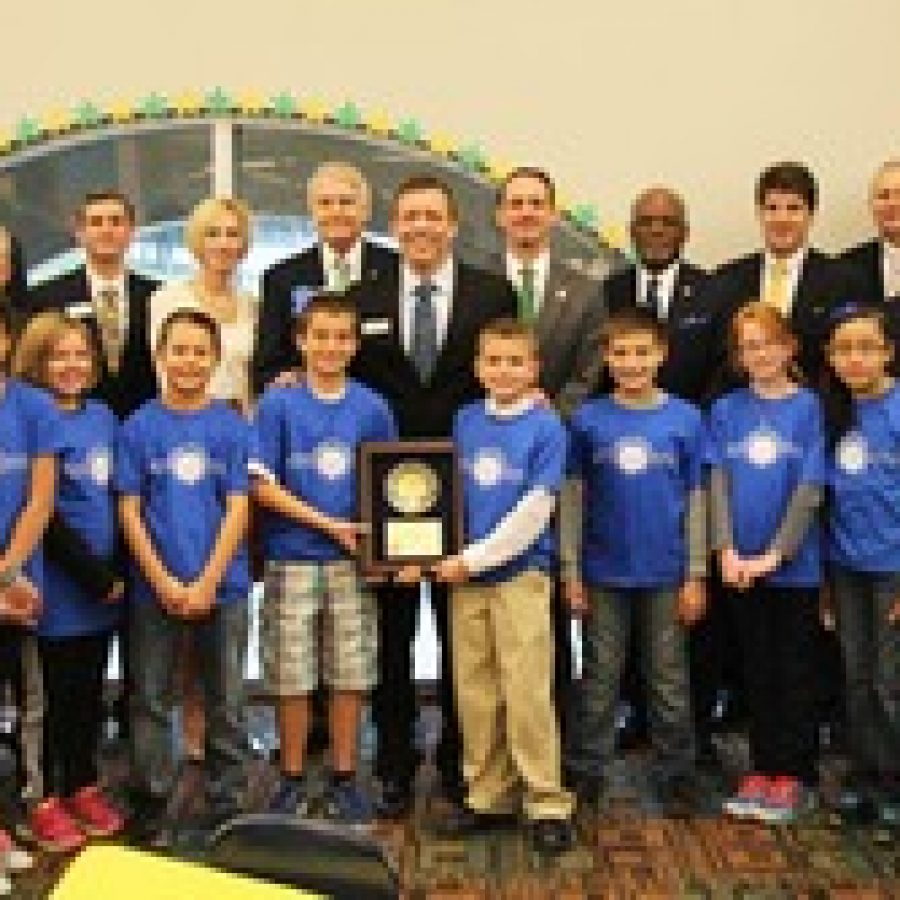 State and local officials celebrate Sappington Elementary Schools National Blue Ribbon School Award on Nov. 20. Pictured with Sappington fifth-grade ambassadors, from left, are: Board of Education member and Rep. Vicki Englund; Sen. Eric Schmitt; County Councilman Pat Dolan; Green Park Ward 1 Alderman Anthony Pousosa; Rep. Genise Montecillo; retired Sappington teacher Barry Bierwirth; Principal Craig Hamby; Sen. Scott Sifton; County Executive Charlie Dooley; Brecht Mulvihill, representing U.S. Rep. Ann Wagner; Superintendent Jim Simpson; Brendan Fahey, representing U.S. Sen. Claire McCaskill; and Assistant Principal Angie Moehlmann.
 