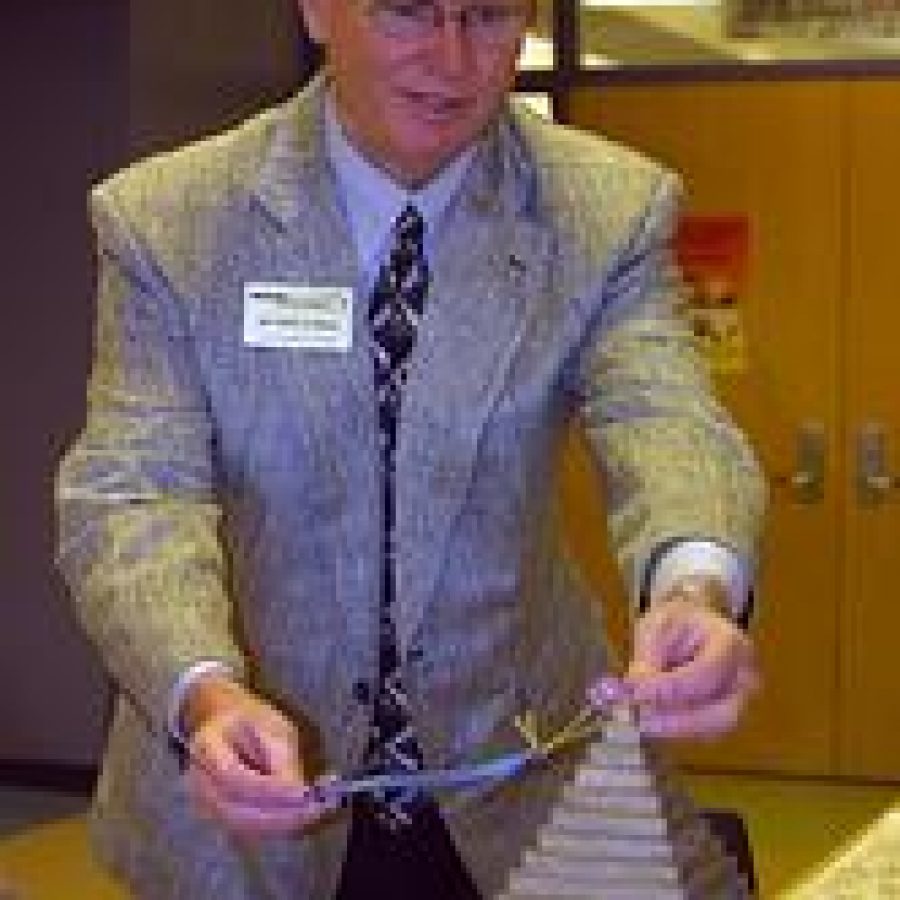 Mehlville Superintendent Terry Noble, serving as a judge for Oakville Elementary Schools sixth annual Creative Challenge, awards a Judges Favorite ribbon to an art project featuring an ancient Egyptian pyramid. Nearly 50 third-, fourth- and fifth-grade pupils participated in this years challenge. Bill Milligan photo 