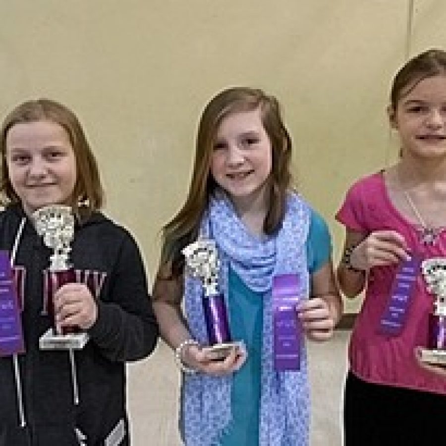 Kaitlyn Pluff, fifth-grade, left, won the Gotsch Intermediate School Spelling Bee and will go on to compete in the St. Louis Post-Dispatch 2013 Spelling Bee Semifinal Competition in March. Kim Welch, fourth-grade, center, came in second, and Anna Bohnert, fourth-grade, came in third. 