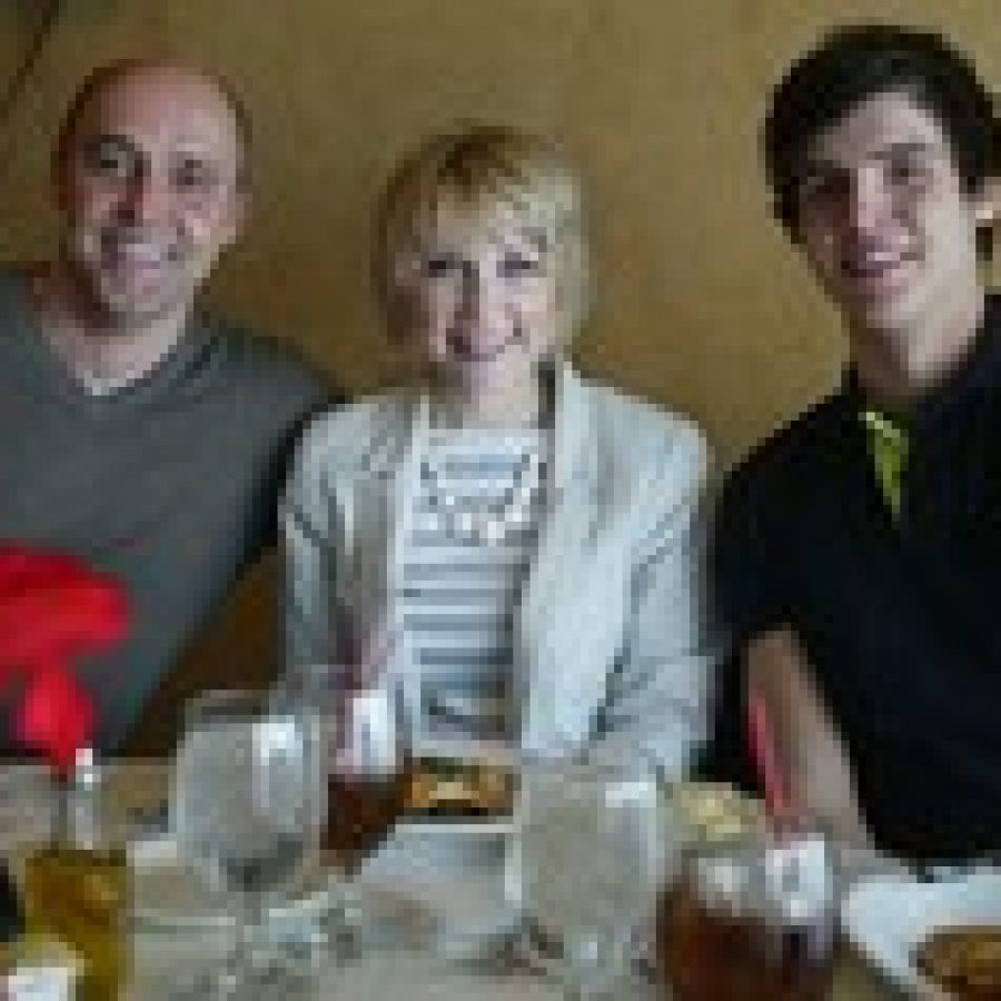 Amanda Trybula, who grew up in south county, is pictured with Bernd Lang, left, her bone-marrow donor from Freimersheim, Germany, and Lang's son Joshua.