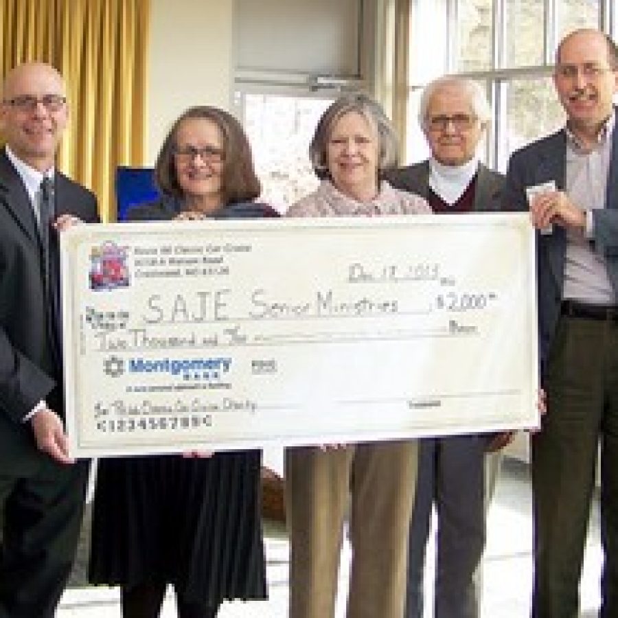 Steve Boggeman, left, executive director of the Crestwood-Sunset Hills Area Chamber of Commerce, presents a check for \$2,000 to Seniors of Advent, St. Justin and St. Elizabeth Senior Ministry  representatives, from left, Deb Goldfeder, Mary Chubb, Eliott Chubb and the Rev. Dan Handschy. 