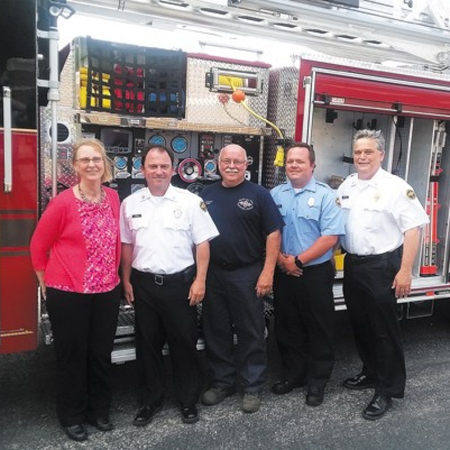 The Mehlville Fire Protection District recently took delivery of a new 75-foot aerial ladder truck. Pictured, from left, are: Board of Directors Treasurer Bonnie Stegman, Chief Brian Hendricks, Chief Mechanic Ken Wenk, Pvt. Mike Mueller and Deputy Chief Dan Furrer. Furrer, Wenk and Mueller serve on the districts Apparatus Committee. Mike Anthony photo