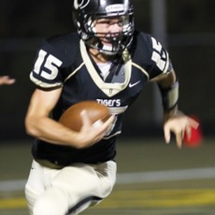 Oakville Senior High School quarterback Andy Oliver, above, led the Tigers to victory Friday night in the fourth quarter, rushing for 140 yards and two touchdowns to propel 4-3 Oakville to a 35-23 comeback win over the 3-4 Mehlville Panthers.
Megan LeFaivre-Zimmerman photo
 