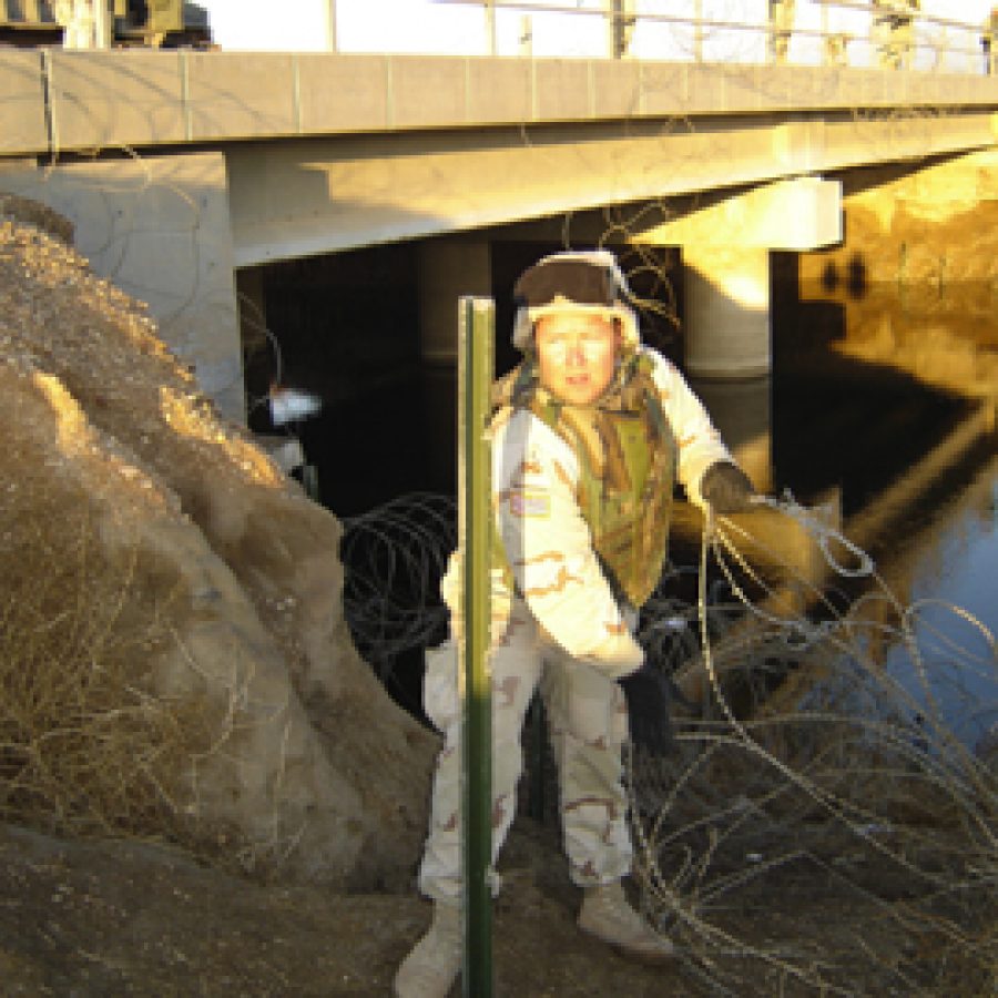 Rep. Jim Avery is shown setting up security on a bridge in Iraq as part of his duties with the National Guards 1140th Engineering Battalion.