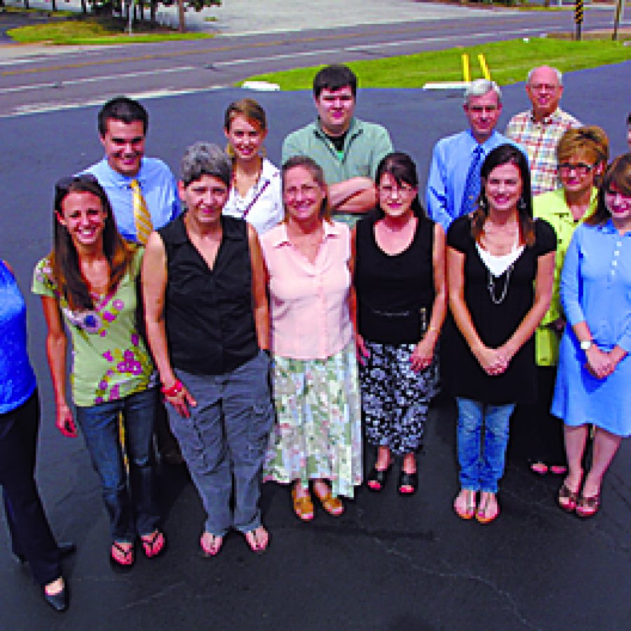 Call Newspapers marks its 20th anniversary this week with the publication of its first-ever three-section edition. Members of the Call staff, first row, from left, are: Christine Williams of classified sales, Lindsey Horvath of classified sales, Valerie Pennington of composing, Publisher Debbie Baker, Joette Wright of circulation, Jennifer Dirnbeck of bookkeeping and Justine Pope, composing intern. Second row, from left, are: Evan Young of the news department, Linden Mueller of advertising sales, Jason Lasher of composing, Mike Anthony of the news department, General Manager Bill Milligan, Cathy Pope of advertising sales and Maggie Menderski, news department intern. Staffers not pictured include Alan Sculley and Stephen Glover, correspondents; Leo and Mary Vogler, maintenance; and Pete and Josephine Licavoli, newspaper stack delivery.