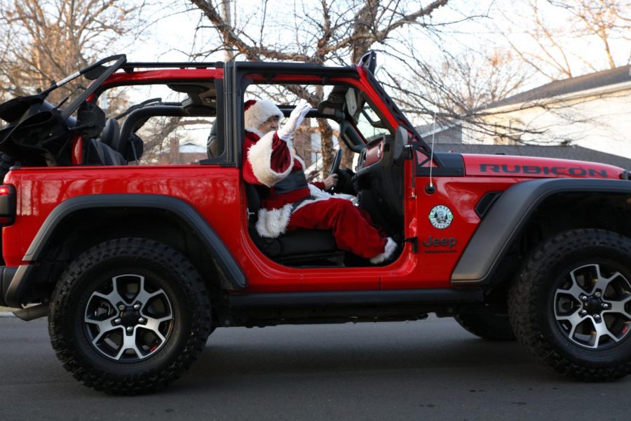 Santa+Claus+traded+his+reindeer+and+sleigh+for+a+red+Jeep+Wrangler+during+the+Christmas+in+Crestwood+parade+in+2020.