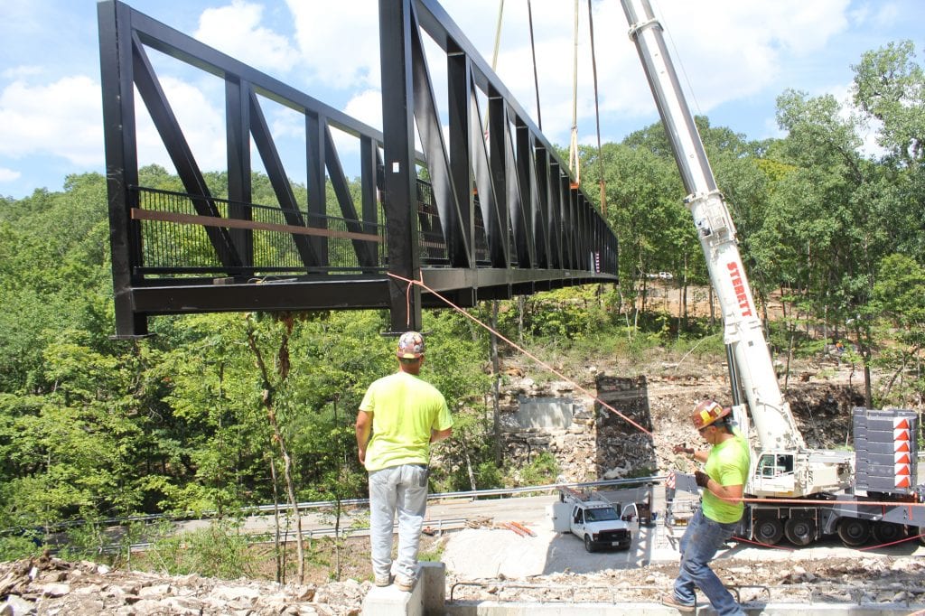 Workers+lower+one+of+the+largest+pedestrian+trail+bridges+in+St.+Louis+County+into+place+at+Cliff+Cave+Park+in+Oakville+in+July.