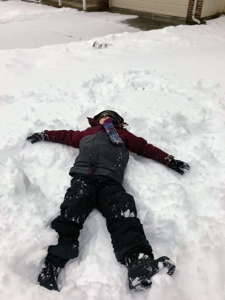 Cooper Jennings makes  a snow angel on a snow day off from school in January 2019. 