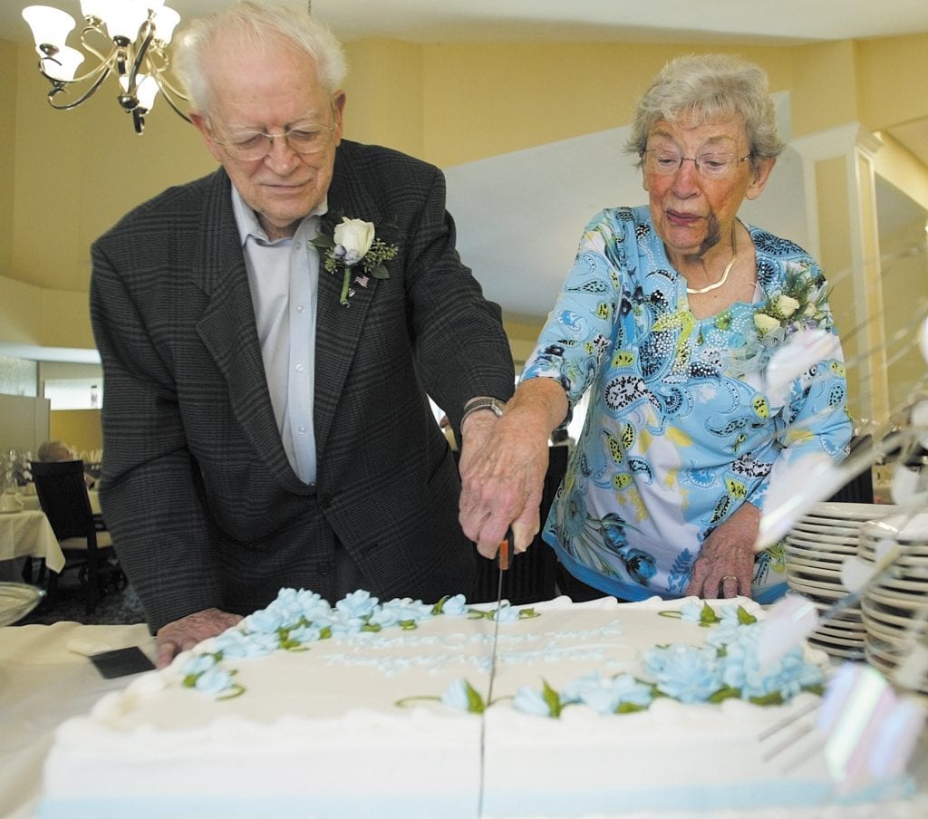Bethesda Terrace residents James and Dorothy Kargus cut the cake during a reception in honor of their wedding.