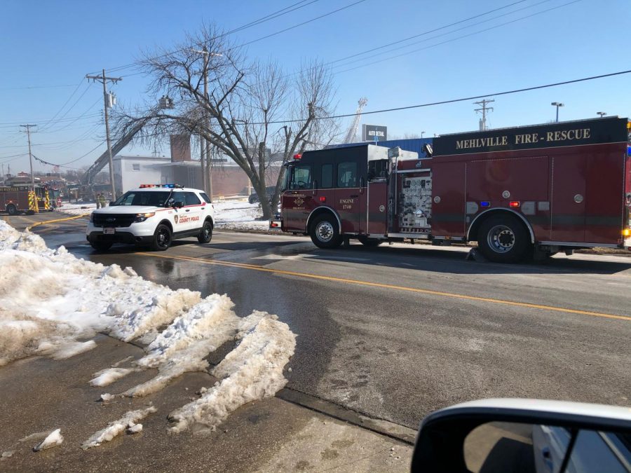 The St. Louis County Police Department and the Mehlville Fire Protection District are shown at the scene of the fire at the vacant building that was once Eime Hardware Saturday, Feb. 20, 2021. 