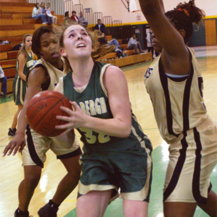 Lindbergh forward Meaghan Endicott, left, encounters some resistance against University City in the third-place game of the Lindbergh High School Varsity Tournament.