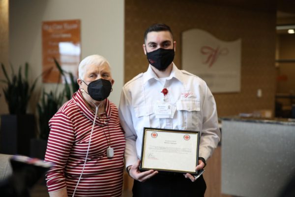 Friendship Village security officer Brandon Soehngen, right, was honored by the Fenton Fire Protection District in February for his quick response to a fire in the apartment of resident Gloria King, left, last December. 