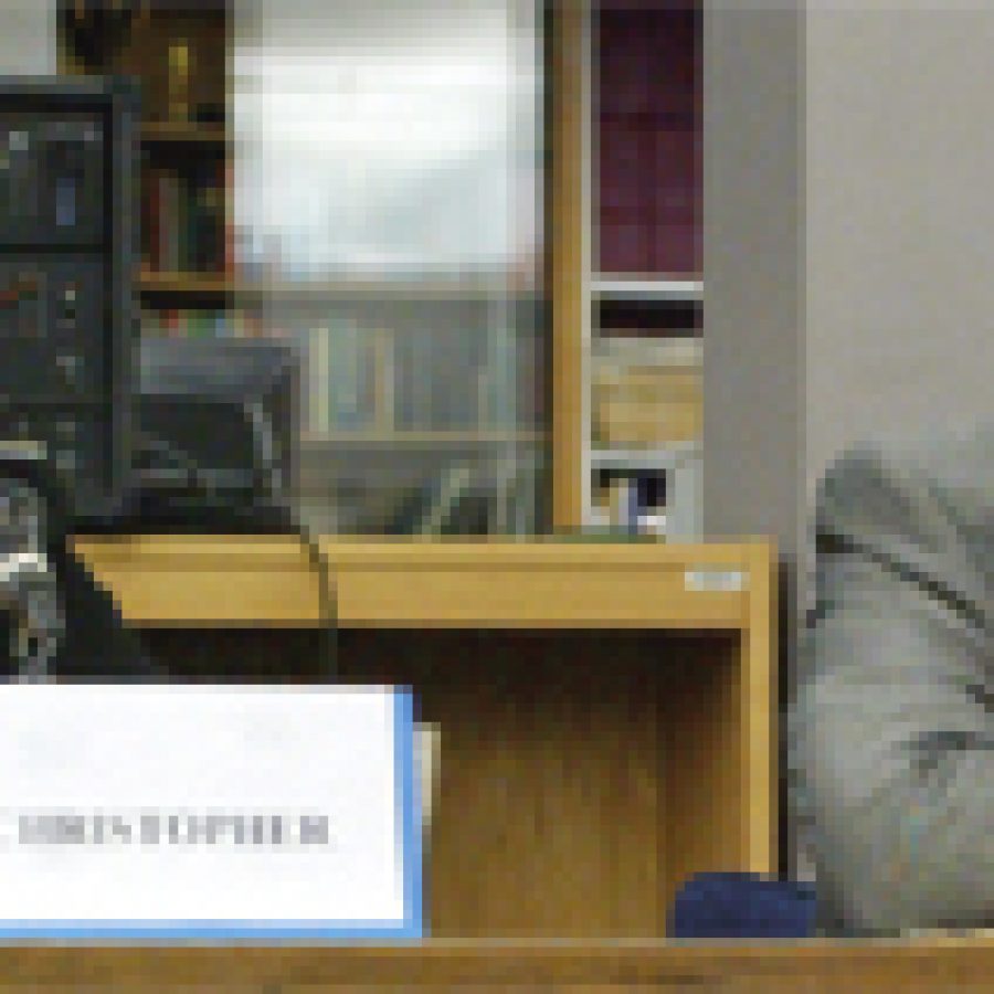 Board member Cindy Christopher stares at candidate Karl Frank, Jr. as he answers a question durng last weeks candidate forum.