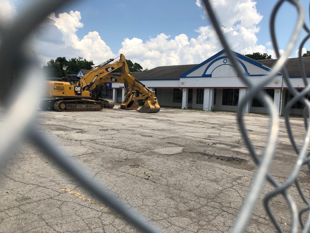 The construction fence and  now-vacant parking lot at Franview Plaza at the site where Sentinel Emergency Solutions will build its company headquarters, as seen Tuesday, July 2. Photo by Erin Achenbach.