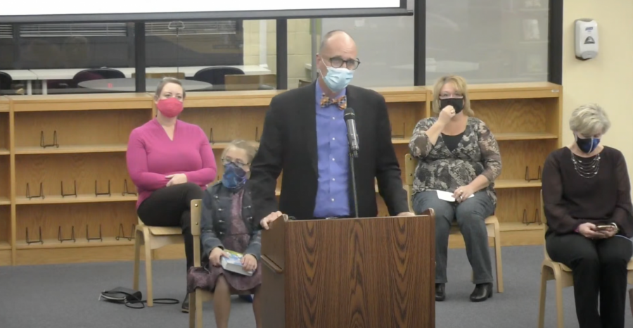 With parents and a student sitting behind him socially distanced, Mehlville Superintendent Chris Gaines presents bond issue information to the Board of Education, including conceptual drawings, at the Oct. 15, 2020, board meeting held in person at the Mehlville High School Library. The presentation was ‘very thorough,’ then board President Kevin Schartner said. The meeting was also livestreamed.